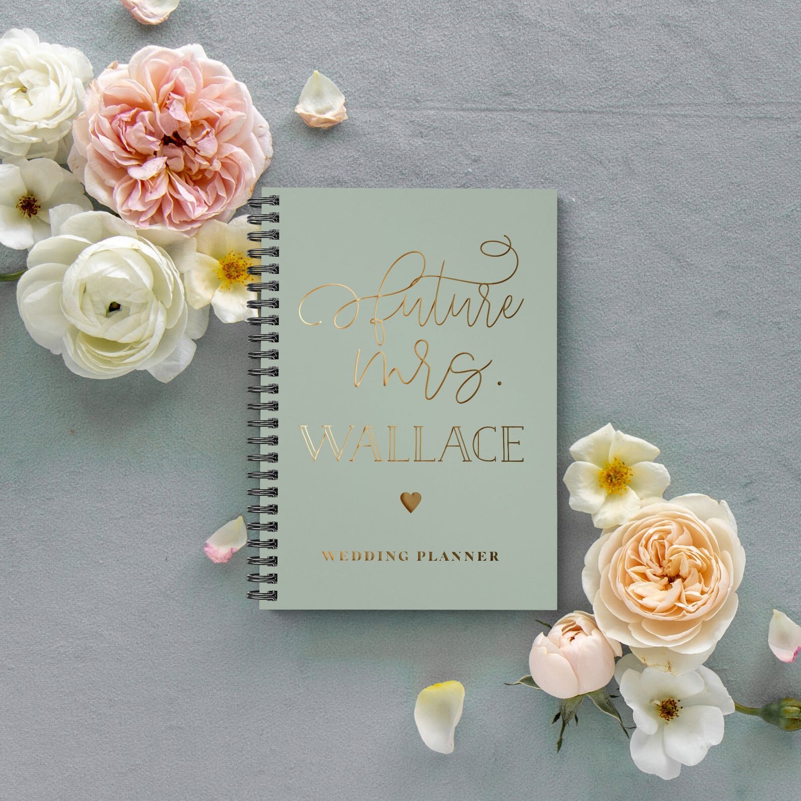 I recently purchased this wedding planner off of Etsy for my best friend as an engagement gift. It has several sections for budgeting, to-do lists, vendors, etc. Click here to check it out and customize one for yourself!